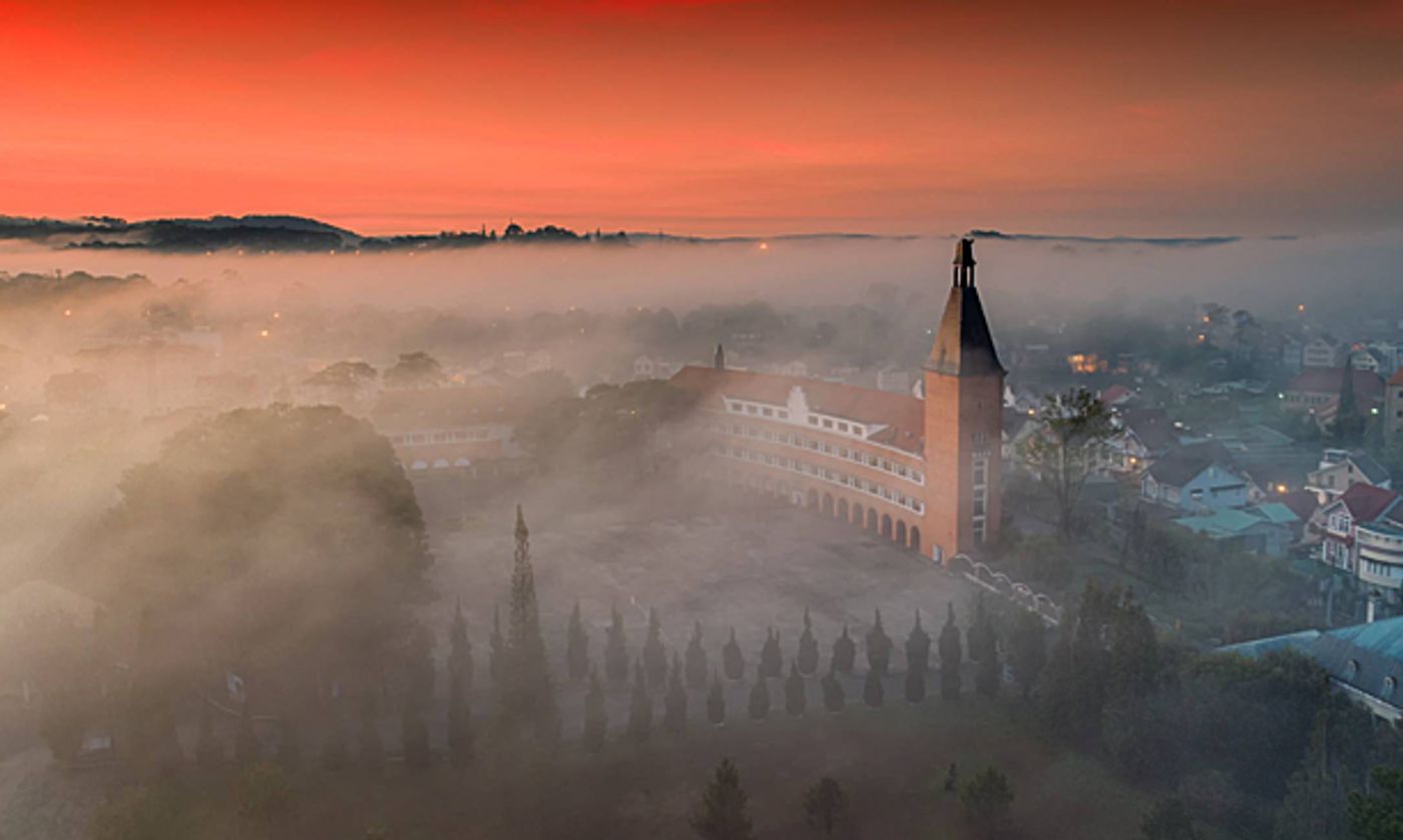 French-built College of Pedagogy on Yersin Street in downtown Da Lat is shrouded in mist. Photo by Tran Quang Anh